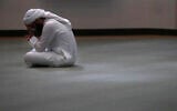 A man bows his head during prayers in an empty mosque in Plano, Texas, May 24, 2020. (LM Otero/AP)