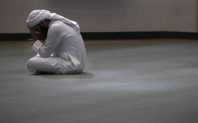A man bows his head during prayers in an empty mosque in Plano, Texas, May 24, 2020. (LM Otero/AP) A man bows his head during prayers in an empty mosque in Plano, Texas, May 24, 2020. (LM Otero/AP)