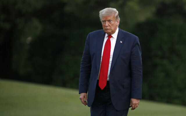 US President Donald Trump walks on the South Lawn of the White House in Washington, May 30, 2020. (Patrick Semansky/AP) US President Donald Trump walks on the South Lawn of the White House in Washington, May 30, 2020. (Patrick Semansky/AP)