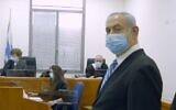 Prime Minister Benjamin Netanyahu at the start of his trial on corruption charges, May 24, 2020. Visible behind him are two of the three judges in the case, Rivka Friedman-Feldman and Oded Shaham (Screen capture/Government Press office)