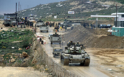 IDF vehicles drive over the Awali bridge as they leave Lebanon on the first day of a planned retreat on February 16, 1985. (Yossi Zamir/Flash90)