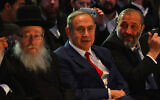 Prime Minister Benjamin Netanyahu (center), Interior Minister Aryeh Deri (right) and then-health minister Yaakov Litzman (left) attend a conference in Lod on November 20, 2016. (Kobi Gideon/GPO)