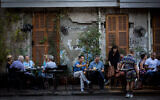 Illustrative: Customers sit at a restaurant on Rothschild Boulevard in Tel Aviv, June 22, 2017. (Miriam Alster/FLASH90)