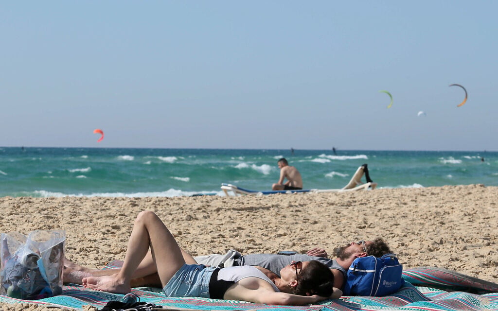 Israelis at the beach in Rishon Lezion on May 1, 2020. (Yossi Aloni/Flash90) Israelis at the beach in Rishon Lezion on May 1, 2020. (Yossi Aloni/Flash90)