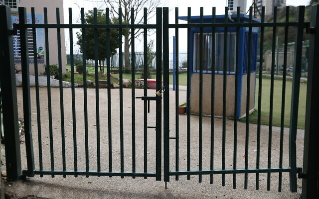 The closed gates of a school in Safed, northern Israel, March 13, 2020. (David Cohen/Flash90)