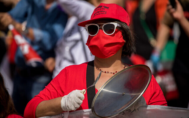 Illustrative -- Self-employed and kindergarten owners participate in a rally calling for financial support from the Israeli government outside the Israeli parliament in Jerusalem, on April 19, 2020 (Yonatan Sindel/Flash90)