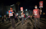 Self-employed, small business owners and activists participate in a rally calling for financial support from the government in Tel Aviv, May 2, 2020. (Miriam Alster/Flash90)
