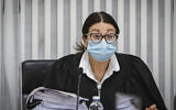 Supreme Court President Esther Hayut arrives for a court session on petitions against the coalition agreement between the Blue and White and Likud parties at the Supreme Court in Jerusalem on May 4, 2020 (Oren Ben Hakoon/POOL)