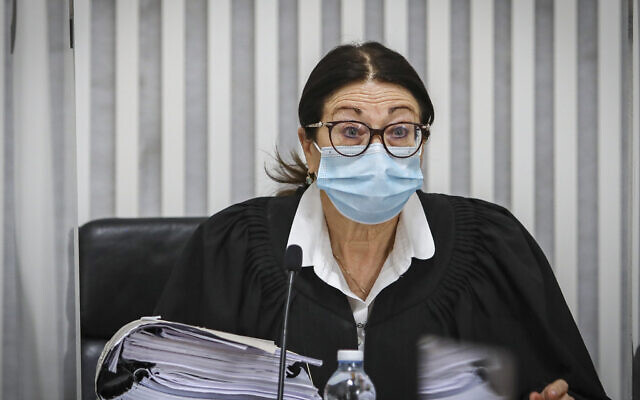 Supreme Court President Esther Hayut arrives for a court session on petitions against the coalition agreement between the Blue and White and Likud parties at the Supreme Court in Jerusalem on May 4, 2020 (Oren Ben Hakoon/POOL) Supreme Court President Esther Hayut arrives for a court session on petitions against the coalition agreement between the Blue and White and Likud parties at the Supreme Court in Jerusalem on May 4, 2020 (Oren Ben Hakoon/POOL)