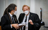 Founder of the Movement for the Quality of Government in Israel, Eliad Shraga (right) waits for Supreme court justices to enter the room for a court session on petitions against the coalition agreement, May 4, 2020 (Oren Ben Hakoon/POOL)