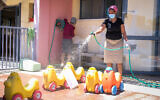Kindergarten staff clean in the city of Modiin on May 7, 2020 (Yossi Zeliger/Flash90)