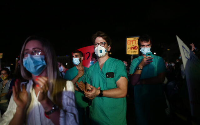 Medical interns demonstrating for better conditions at Habima Square in Tel Aviv on May 9, 2020 (Miriam Alster/Flash90)