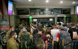Israeli soldiers and others at the central bus station in Jerusalem on May 10, 2020. (Olivier Fitoussi/Flash90)
