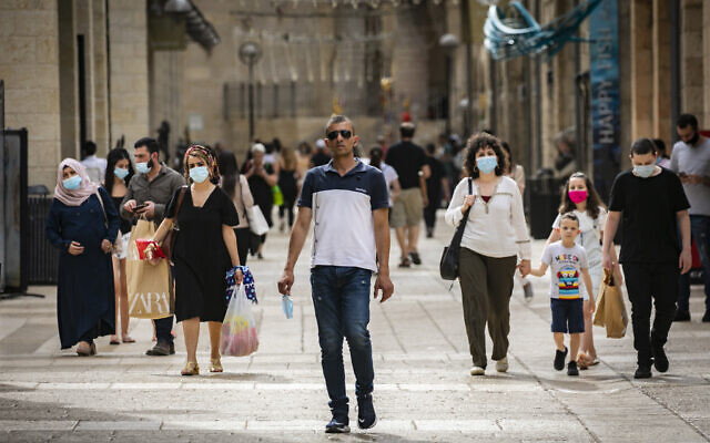 People walk and shop at the Mamilla Mall near Jerusalem's Old City on May 14, 2020. (Olivier Fitoussi/Flash90) People walk and shop at the Mamilla Mall near Jerusalem's Old City on May 14, 2020. (Olivier Fitoussi/Flash90)