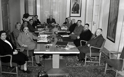 Israel's First Government, photographed on May 1, 1949. Left to right: Golda Meir, Zalman Shazar, Bechor-Shalom Sheetrit, Zvi Maimon (cabinet stenographer), Dov Yosef, Eliezer Kaplan, Moshe Sharett, Prime Minister David Ben-Gurion, Ze'ev Sherf (cabinet secretary), Pinchas Rosen, David Remez, Haim Moshe Shapira, Yitzhak Meir Levin, Yehuda Leib Maimon. (Hugo Mendelson/National Photo Collection of Israel/GPO/Wikipedia/Public domain) Israel's First Government, photographed on May 1, 1949. Left to right: Golda Meir, Zalman Shazar, Bechor-Shalom Sheetrit, Zvi Maimon (cabinet stenographer), Dov Yosef, Eliezer Kaplan, Moshe Sharett, Prime Minister David Ben-Gurion, Ze'ev Sherf (cabinet secretary), Pinchas Rosen, David Remez, Haim Moshe Shapira, Yitzhak Meir Levin, Yehuda Leib Maimon. (Hugo Mendelson/National Photo Collection of Israel/GPO/Wikipedia/Public domain)