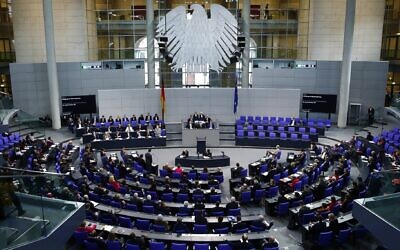 German Chancellor Angela Merkel answers the questions of deputies at Bundestag in Berlin, Germany on December 18, 2019. (Abdulhamid Hosbas/Anadolu Agency via Getty Images via JTA)