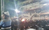 Ultra-Orthodox Israelis celebrate the Jewish holiday of Lag B'Omer in the Mea Shearim neighborhood of Jerusalem on May 11, 2020. (Screen capture/Twitter)