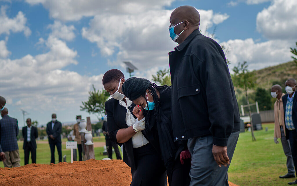Relatives grieve a COVID-19 fatality at a burial ceremony at the Nasrec Memorial Park outside Johannesburg, South Africa, April 16, 2020. (AP/Jerome Delay, File)