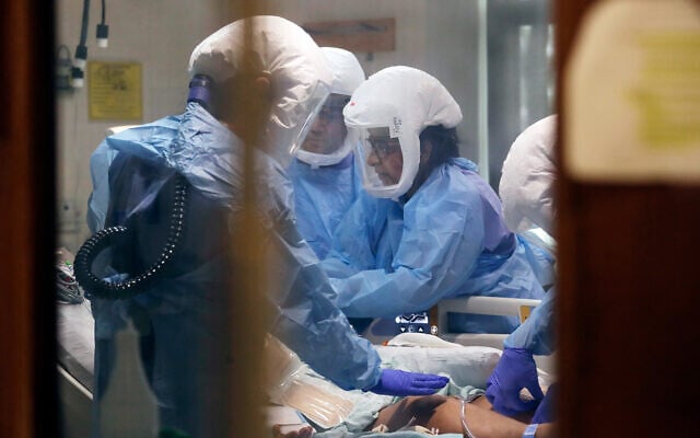 Medical staff attend to a patient in the COVID-19 Intensive Care Unit at Harborview Medical Center in Seattle, Washington, May 8, 2020. (AP/Elaine Thompson) Medical staff attend to a patient in the COVID-19 Intensive Care Unit at Harborview Medical Center in Seattle, Washington, May 8, 2020. (AP/Elaine Thompson)