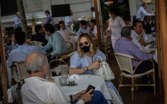 Customers at a bar terrace in Madrid, Spain, May 25, 2020. (AP/Bernat Armangue) Customers at a bar terrace in Madrid, Spain, May 25, 2020. (AP/Bernat Armangue)
