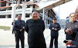 North Korean leader Kim Jong Un, center, visits a fertilizer factory in South Pyongan, near Pyongyang, North Korea, May 1, 2020. (Korean Central News Agency/Korea News Service via AP)