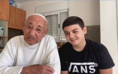 Gal Ohayon, 16, right, with his 89-year-old grandfather Yaakov Shkory, who have been spending the coronavirus crisis together.(Courtesy Facebook LIve screengrab)