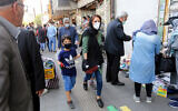 Iranians walk in the streets of the capital Tehran, May 9, 2020. (Atta Kenare/AFP)