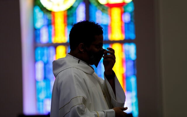 Illustrative: An in-person Mass at Christ the King Catholic Church in San Antonio, Texas, May 19, 2020. (AP/Eric Gay) Illustrative: An in-person Mass at Christ the King Catholic Church in San Antonio, Texas, May 19, 2020. (AP/Eric Gay)