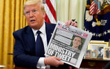 US President Donald Trump holds up a copy of the New York Post before signing an executive order aimed at curbing protections for social media giants, the White House, May 28, 2020. (AP/Evan Vucci)