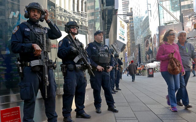 Illustrative: New York City anti-terror police officers in Times Square November 4, 2016. (AP/Bebeto Matthews) Illustrative: New York City anti-terror police officers in Times Square November 4, 2016. (AP/Bebeto Matthews)