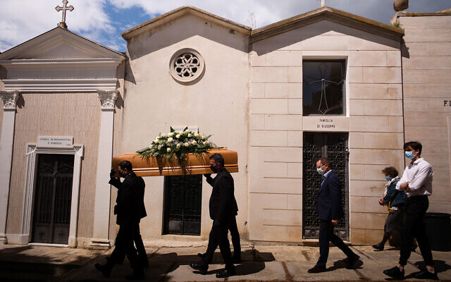 A funeral procession in Montepagano, central Italy, May 12, 2020. (AP/Domenico Stinellis) A funeral procession in Montepagano, central Italy, May 12, 2020. (AP/Domenico Stinellis)