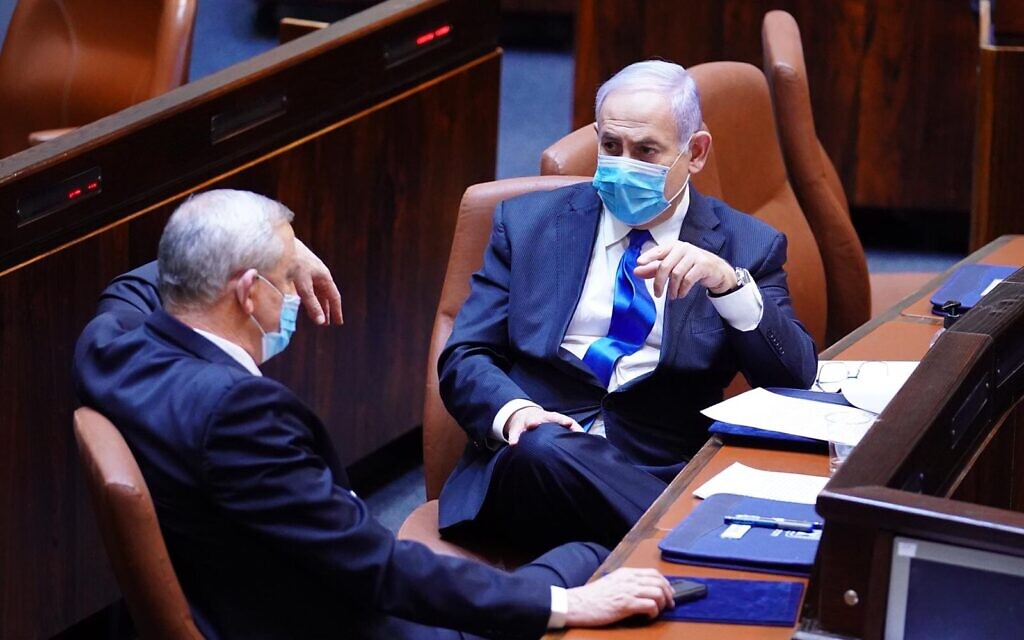 Blue and White chairman Benny Gantz (L) and Prime Minister Benjamin Netanyahu in the Knesset plenum on May 17, 2020, as their new coalition was sworn in. (Knesset) Blue and White chairman Benny Gantz (L) and Prime Minister Benjamin Netanyahu in the Knesset plenum on May 17, 2020, as their new coalition was sworn in. (Knesset)