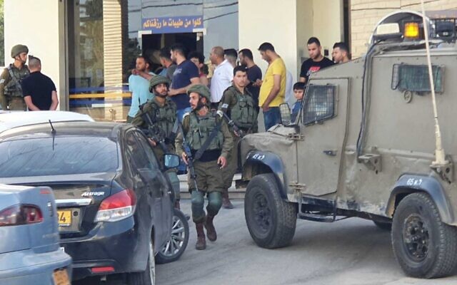 IDF soldiers in the West Bank town of Hawara after a suspected terror shooting attempt on May 20, 2020. (Shomron Regional Council) IDF soldiers in the West Bank town of Hawara after a suspected terror shooting attempt on May 20, 2020. (Shomron Regional Council)