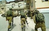 Illustrative: Israeli troops search for the person who threw a brick at Sgt. First Class Amit Ben-Ygal, killing him, in the West Bank village of Yabed on May 13, 2020. (Israel Defense Forces)