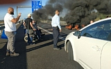 Activists block the Ayalon Highway near Tel Aviv on May 31, 2020, demanding increased stipends for people with disabilities. (Lavi Naor/courtesy)