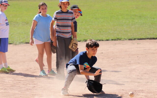 Kids play softball at Camp Ramah in California (Courtesy of Ramah in California) Kids play softball at Camp Ramah in California (Courtesy of Ramah in California)