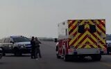 Emergency officials at the scene of a shooting at Naval Air Station Corpus Christi on May 21, 2020. (screen capture: AP Video)