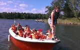 Boating is among the many activities at the 111-year-old Glamsta Jewish summer camp in Sweden. (Courtesy of Glämsta via JTA)