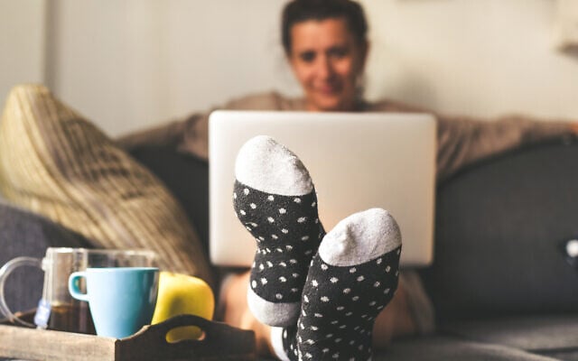 Illustrative: A woman sits on a couch in her living room (Fabio Principe; iStock by Getty Images) Illustrative: A woman sits on a couch in her living room (Fabio Principe; iStock by Getty Images)