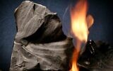 Oil shale rock burns on its own once lit with a blow torch. (AP Photo/Douglas C. Pizac)