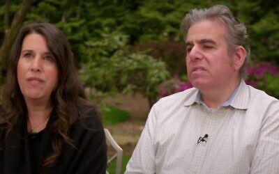 Screen capture from video of an interview with two of the first people in New York to become infected with the coronavirus, Lawrence Garbuz, right, and his wife Adina. (YouTube)
