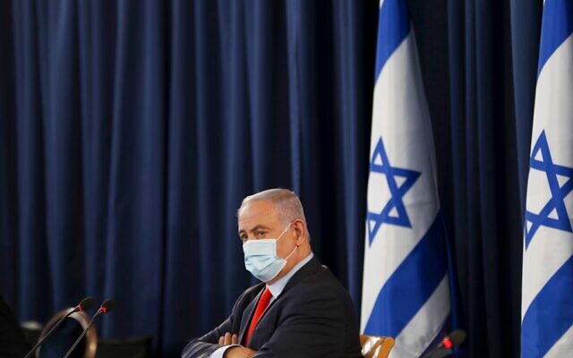 Benjamin Netanyahu, wearing a protective face mask, chairs the weekly cabinet meeting in Jerusalem on May 31, 2020. (RONEN ZVULUN / POOL / AFP) Benjamin Netanyahu, wearing a protective face mask, chairs the weekly cabinet meeting in Jerusalem on May 31, 2020. (RONEN ZVULUN / POOL / AFP)