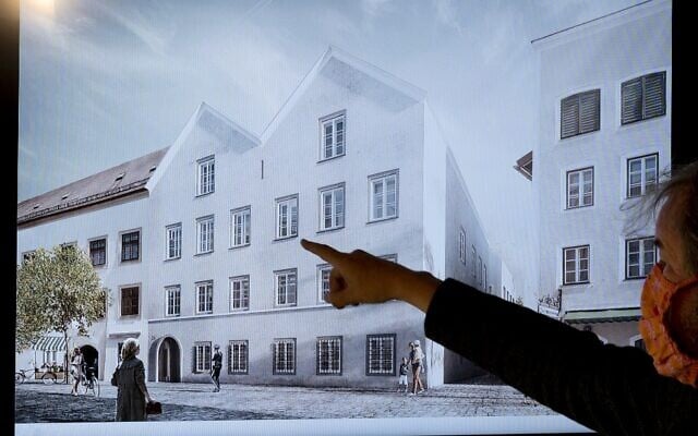 A man points his finger at a screen showing the planned architectural redesign of the house Adolf Hitler was born in, during a press conference at the interior ministry in Vienna, June 2, 2020. (Joe Klamar/AFP/File)