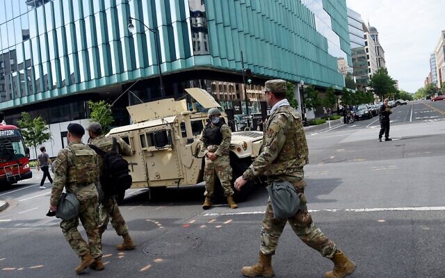Members of the DC National Guard patrol a street near the White House on June 2, 2020, in Washington, DC. (Olivier DOULIERY / AFP) Members of the DC National Guard patrol a street near the White House on June 2, 2020, in Washington, DC. (Olivier DOULIERY / AFP)