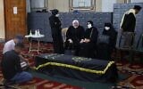 Mourners pray over the coffin of Ramadan Shalah, former leader of the Palestinian Islamic Jihad terror group, during his funeral in the Syrian capital Damascus on June 7, 2020. (AFP)