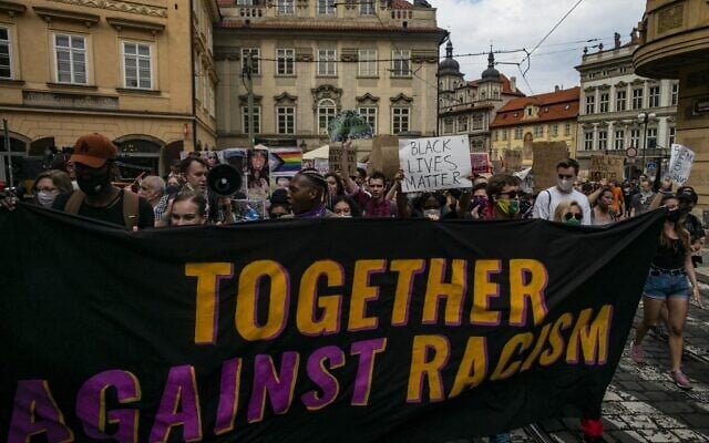 People protest against racism in front of the US embassy in Prague on June 13, 2020. (Michal Cizek / AFP) People protest against racism in front of the US embassy in Prague on June 13, 2020. (Michal Cizek / AFP)