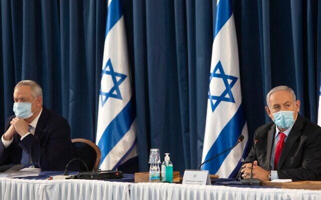 Prime Minister Benjamin Netanyahu (R) and alternate-PM and Defense Minister Benny Gantz attend the weekly cabinet meeting in Jerusalem, on June 14, 2020. (Sebastian Scheiner / POOL / AFP) Prime Minister Benjamin Netanyahu (R) and alternate-PM and Defense Minister Benny Gantz attend the weekly cabinet meeting in Jerusalem, on June 14, 2020. (Sebastian Scheiner / POOL / AFP)