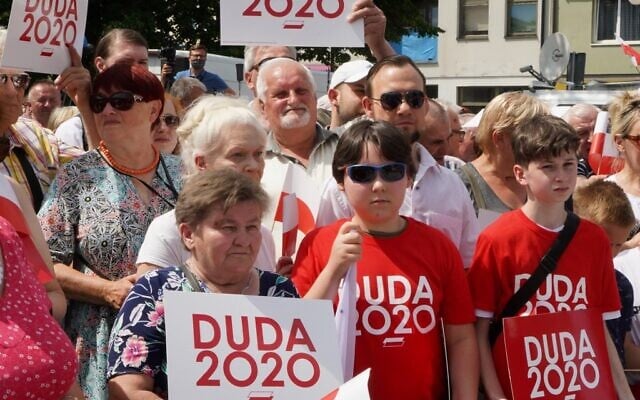 Supporters attend a campaign meeting of Polish President and candidate to his reelection for his Law and Justice (PiS) party Andrzej Duda in Plonsk, central Poland on June 16, 2020. (JANEK SKARZYNSKI/AFP) Supporters attend a campaign meeting of Polish President and candidate to his reelection for his Law and Justice (PiS) party Andrzej Duda in Plonsk, central Poland on June 16, 2020. (JANEK SKARZYNSKI/AFP)