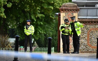 Police officers secure a police cordon near Forbury Gardens park in Reading, west of London, on June 20, 2020 following a stabbing incident the previous day. (Photo by Ben STANSALL / AFP)