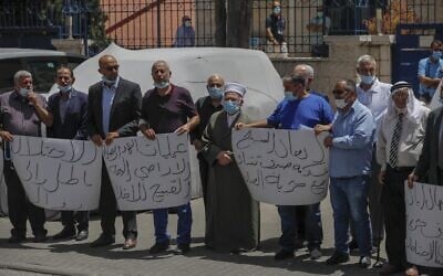 Palestinians demonstrate in front of the EU offices in East Jerusalem during a demonstration demanding the EU intervene against Israel's plans to annex West Bank settlements and the Jordan Valley, on June 22, 2020. (AHMAD GHARABLI / AFP)